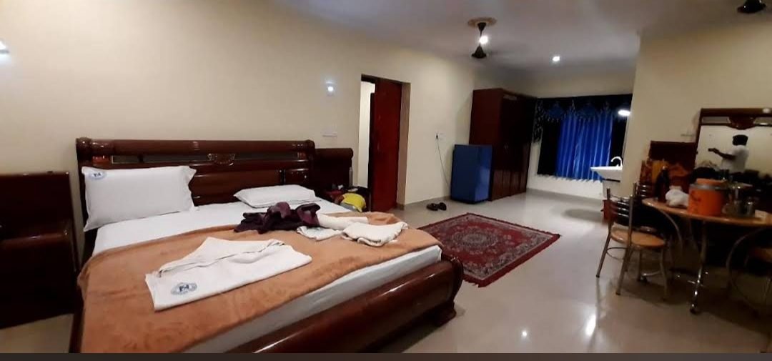 A guest room at Hotel Supreme A/C